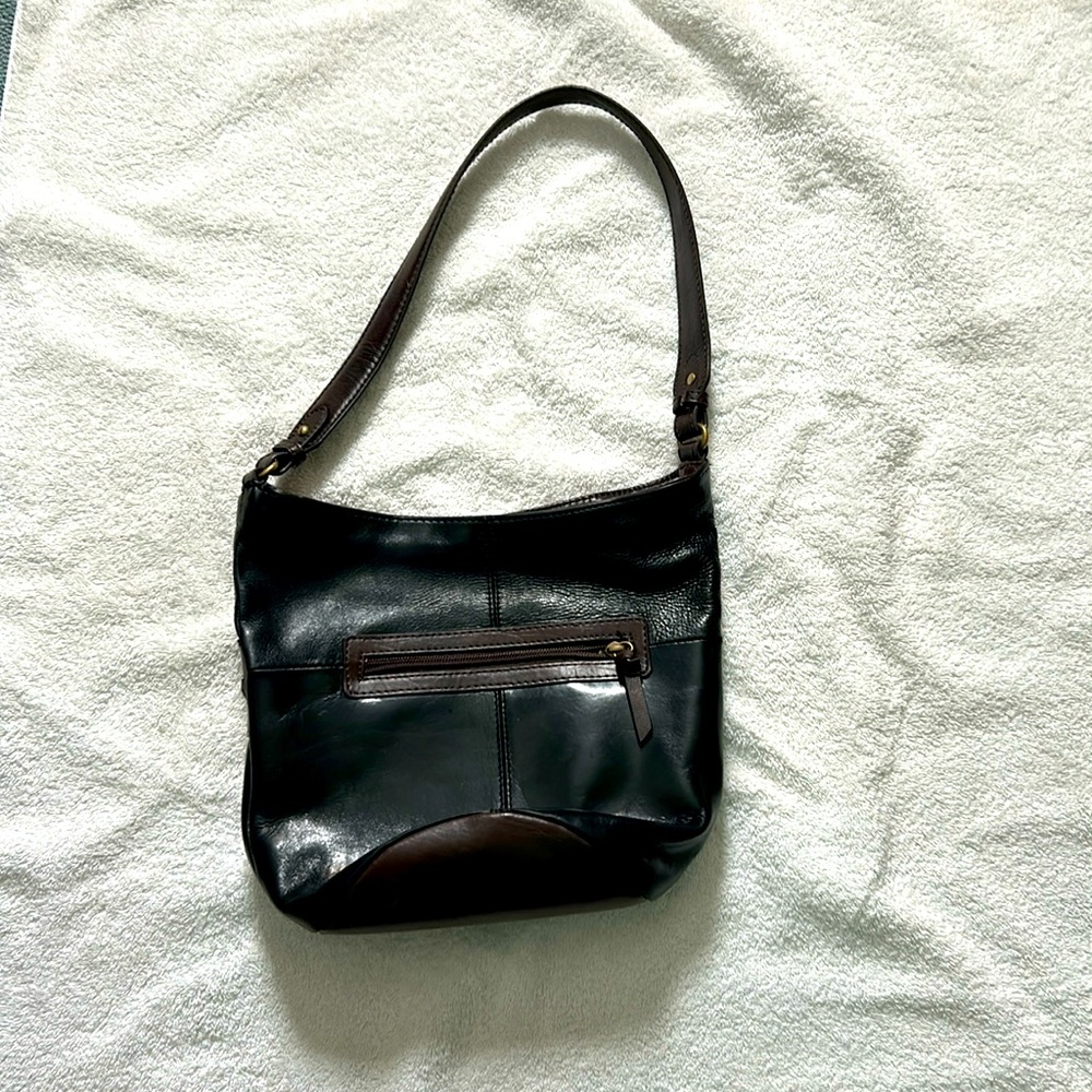 Round bottom black Tignanello shoulder bag.